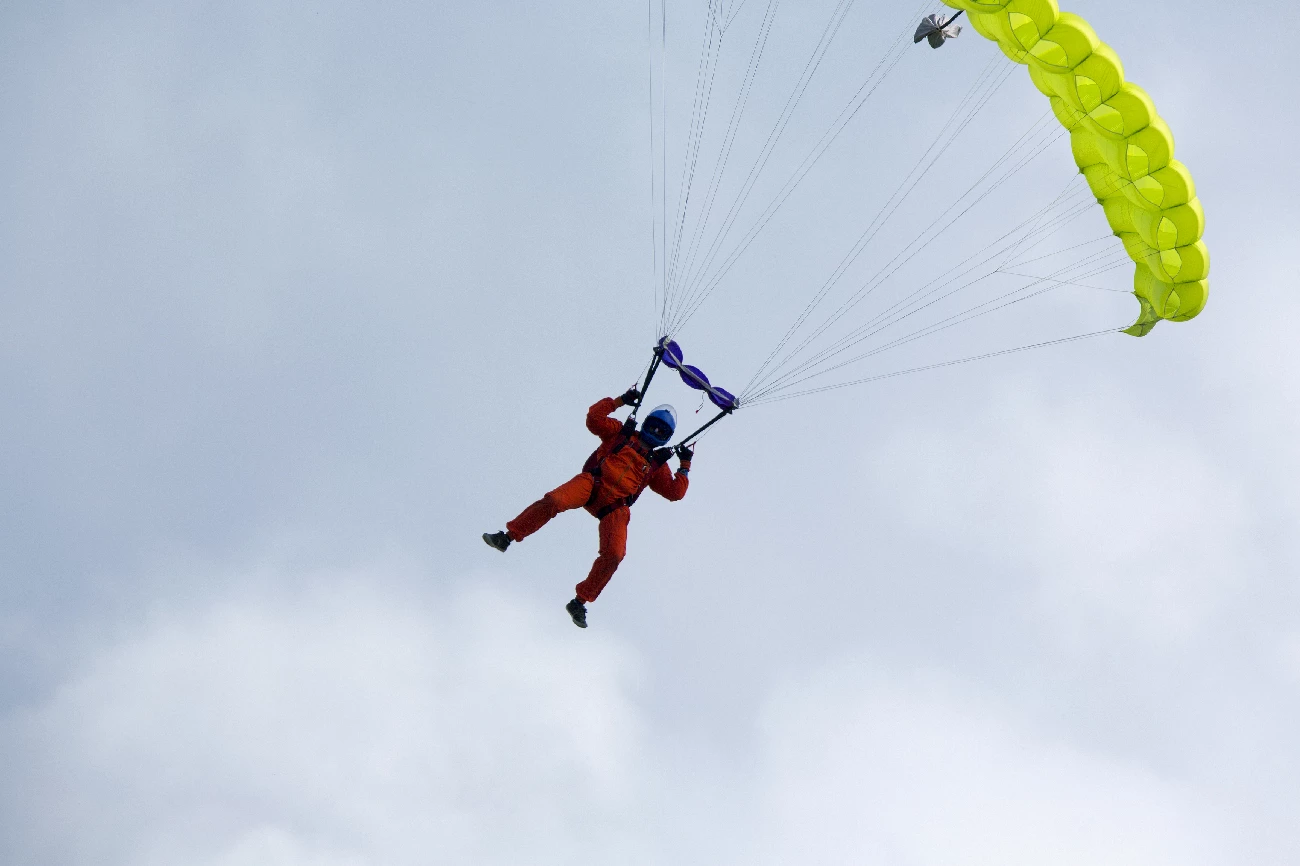 guy on parachute coming down